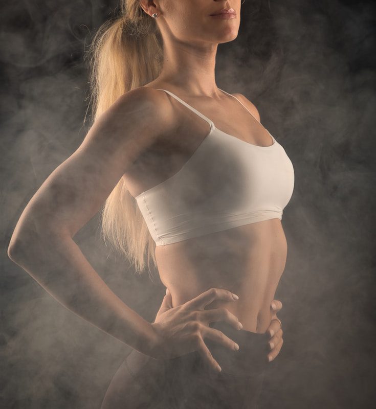 woman in white spaghetti strap top