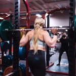 woman in black tank top and black leggings doing exercise