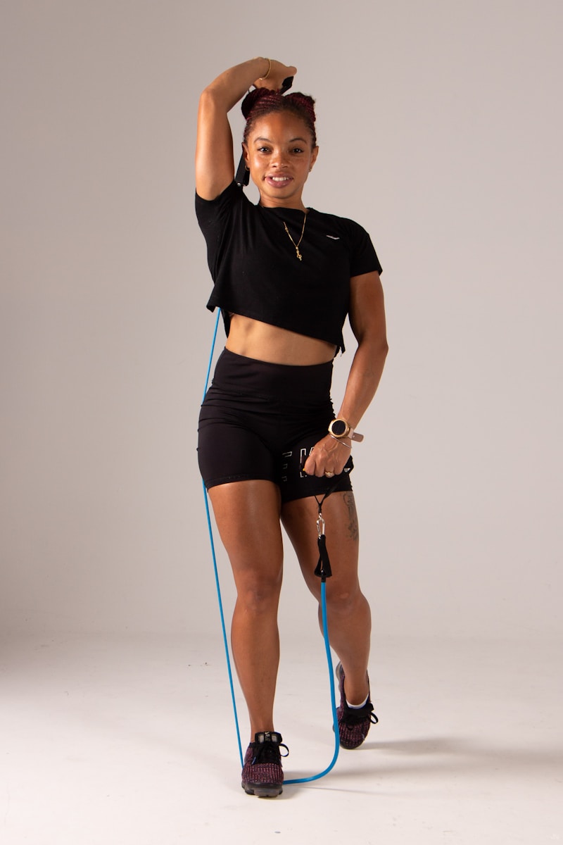 a woman with a jump rope in her hand